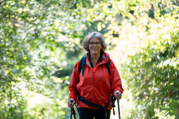 istock Active female senior hiking in nature 1265862022