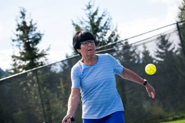 istock Active senior playing pickleball at a public court 1265862172