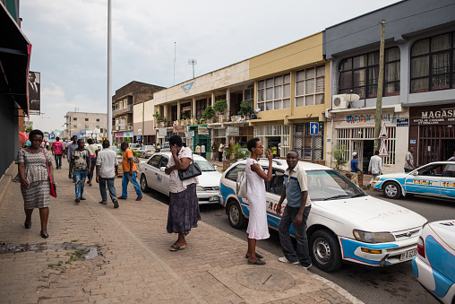 Bujumbura / Burundi - October 15, 2016: group of women in crowded street next to taxi stand in the capital of Burundi