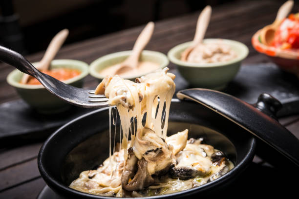 istock Mushroom cheese fondue with dips in background 1265879778