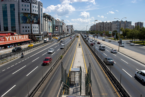 Istanbul,Turkey- August 10,2020:Yenibosna district in istanbul.A traffic in one of the main highways in Istanbul E5.Metrobus, a part of public transportation system, eases the traffic in Istanbul .