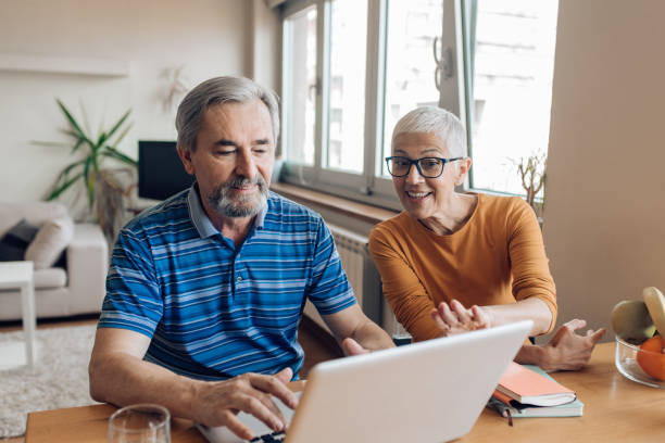 istock Mature entrepreneurs working from home together 1265900898
