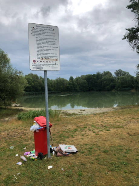 istock Garbage in nature by the lake 1265914185