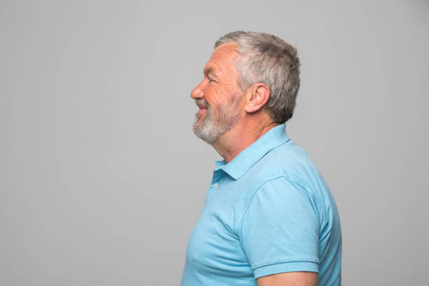 istock Side view of smiling senior man 1265915556
