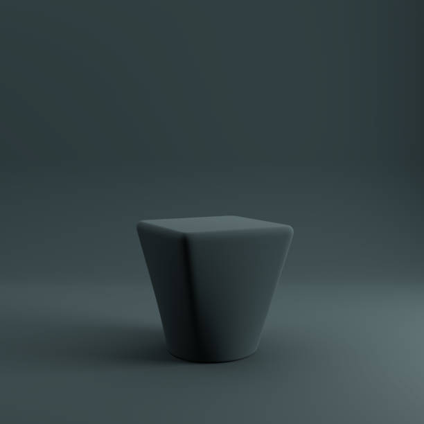 Geometric pedestal or product podium mockup isolated from dark background. stock photo