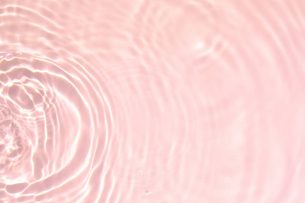 istock pink transparent clear water surface texture summer background 1265915634