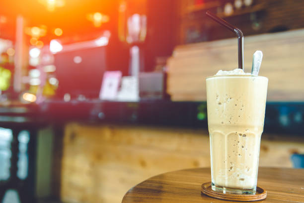 istock Coffee Smoothie milk shake sweet cool ice blended drink with caffeine refresh menu on coffee shop table with space for text 1265915658