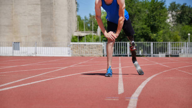 istock Sportsman running on stadium track 1265922216