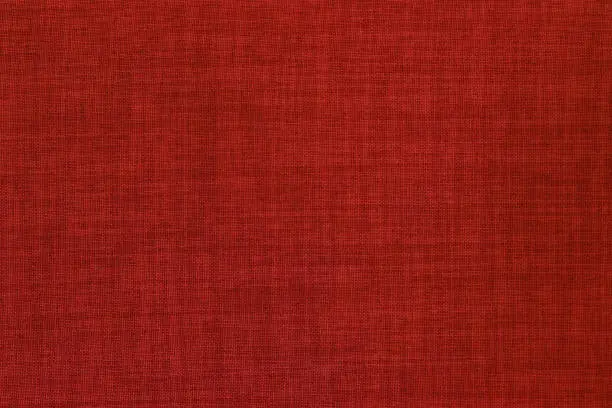 Photo of Dark red linen fabric cloth texture background, seamless pattern of natural textile.