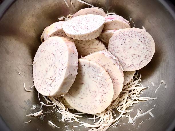 istock Close Up of Fresh Cut Taro with Roots 1265924416