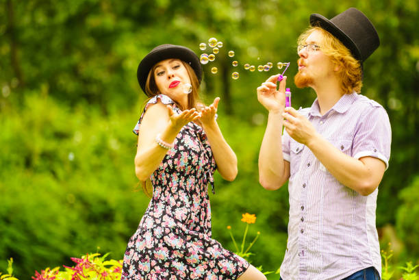 istock Couple blowing bubbles outdoor 1265926601