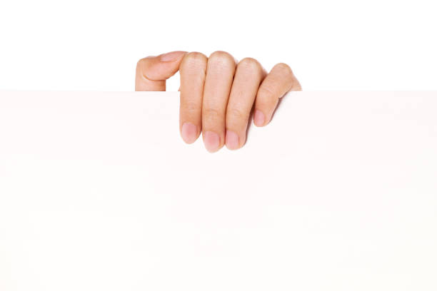istock Woman hand hold a blank paper isolated on white. 1265927651