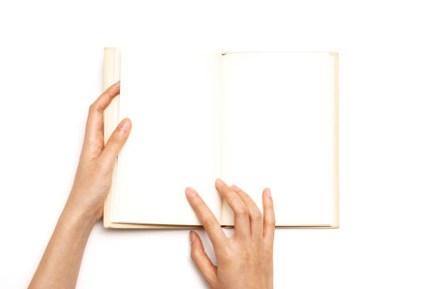 Light coming from book in woman's hands in gesture of giving, offering. Concept of wisdom, religion, reading, imagination.