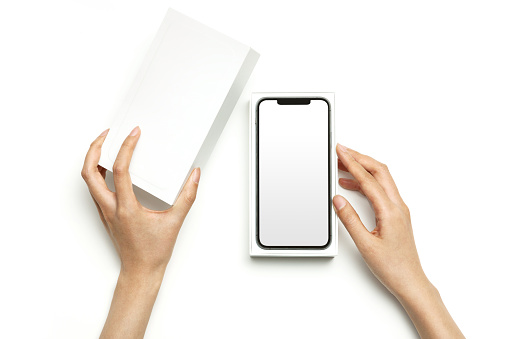 woman hand, white background. smartphone package box