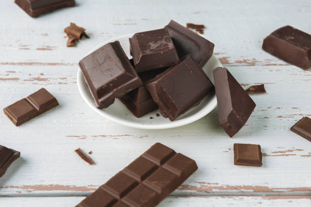 istock Pieces of chocolate with chocolate shavings 1265941346