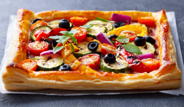 istock Puff pastry pizza with grilled vegetables. Grey background. Close up. 1265941792