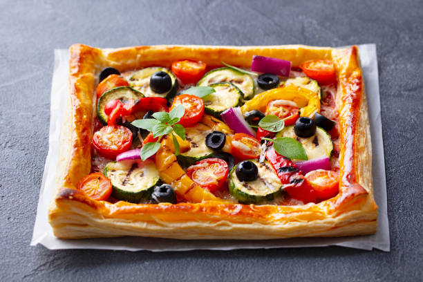 istock Puff pastry pizza with grilled vegetables. Grey background. Close up. 1265944460