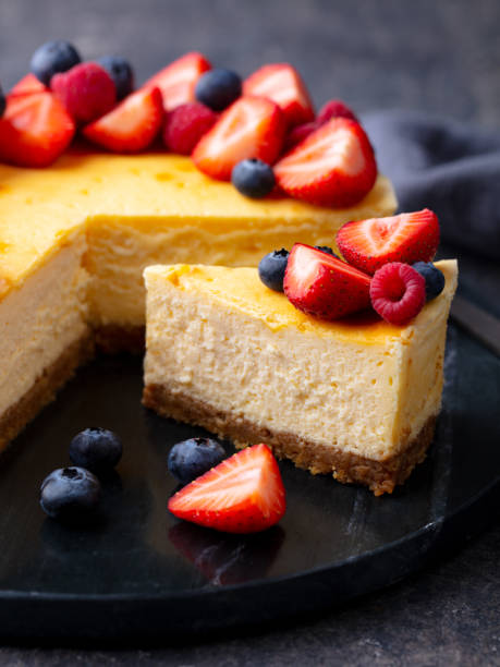 istock Cheesecake dessert with fresh berries. Dark background. Close up. 1265949681