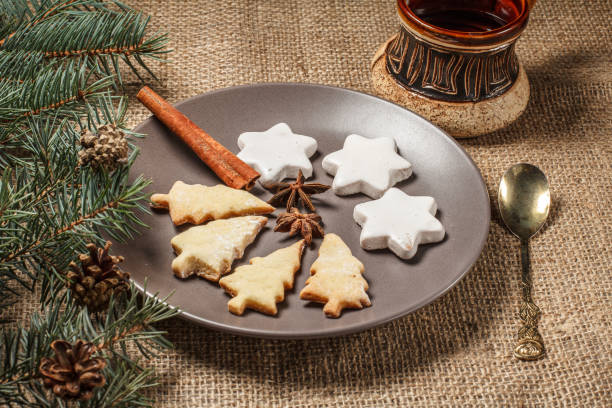 istock Gingerbread cookies in Christmas tree and star shape on plate 1265955078