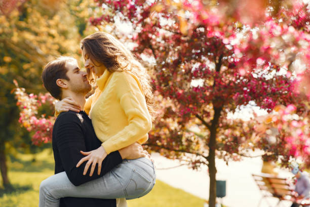 istock Beautiful couple spend time in a spring park 1265956896