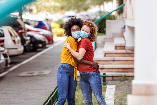 istock Happy multiracial girlfriends in love embracing 1265957731
