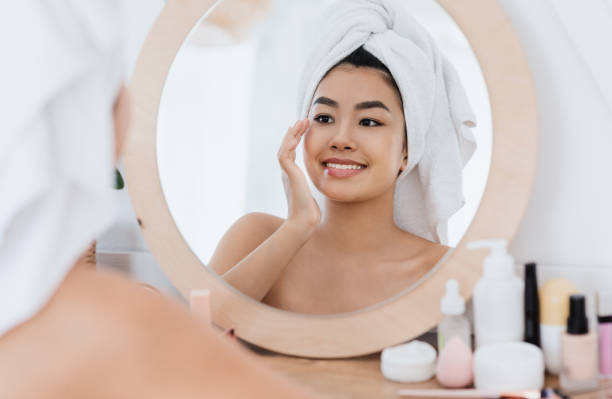 istock Asian woman rubbing her eye zone after shower at home 1265958310