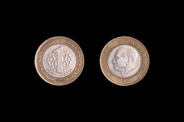 istock Turkish One Lira Coins Isolated On black. close-up. 1265958942