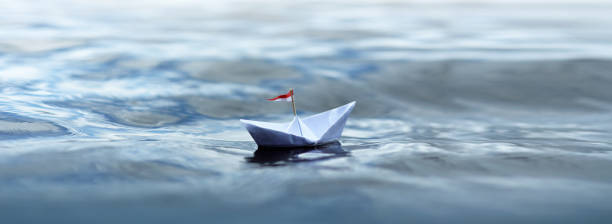 istock Paper Boat sailing - Panorama 1265959468