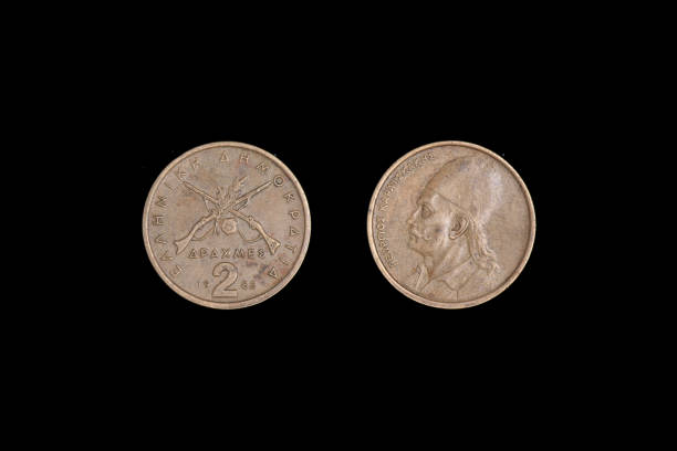 istock 2 drachmes 1982 coin isolated on black background, Greece. both sides close-up 1265962174