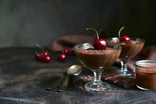 Homemade delicious chocolate mousse or pannacota with cherry