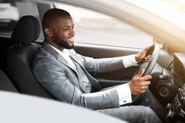 istock Cheerful african american businessman driving to work 1265965253