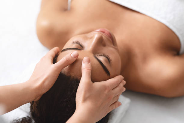 istock Unrecognizable therapist making acupressure head massage for young woman 1265965437