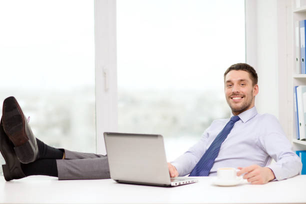 istock smiling businessman or student with laptop 1265972581