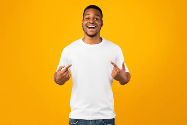 istock Handsome Black Guy Pointing At Himself Posing On Yellow Background 1265973823
