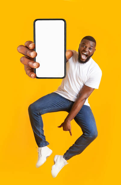 istock Closeup of smartphone with blank screen in black guy hand 1265985240