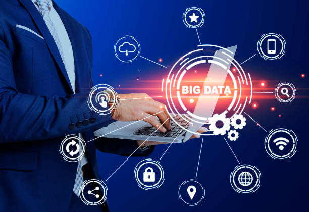 istock Modern technologies. Businessman using laptop and big data pictograms on trnsparent screen. Collage 1265986366