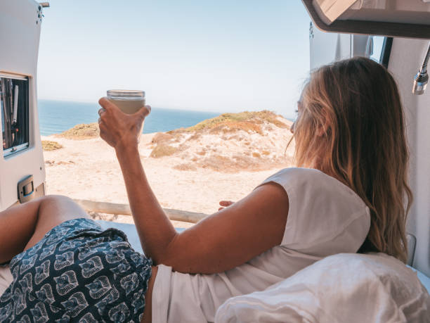 istock Waking up on the edge of a cliff, van life concept 1265988565