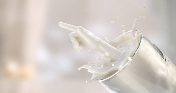 istock 3d rendering of a drop of milk in a glass. 1265990530