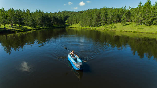 istock The girl enjoys nature, kayaking 1266014349