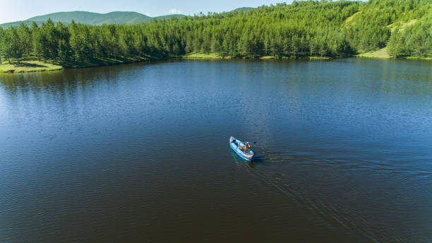 istock A woman kayaking and enjoying a beautiful day 1266015723