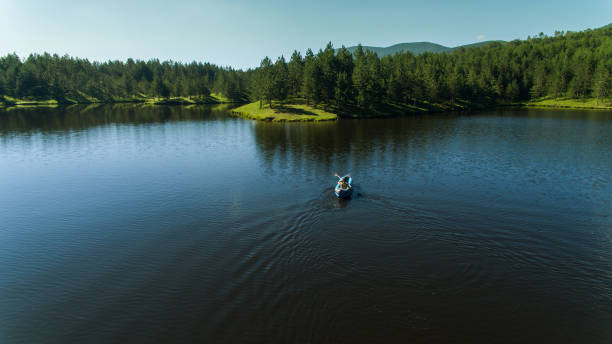 istock A young woman's kayaker practices on the lake 1266015788