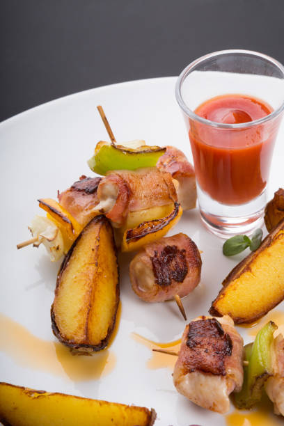 istock Chiken with bacon served on skewer 1266015911