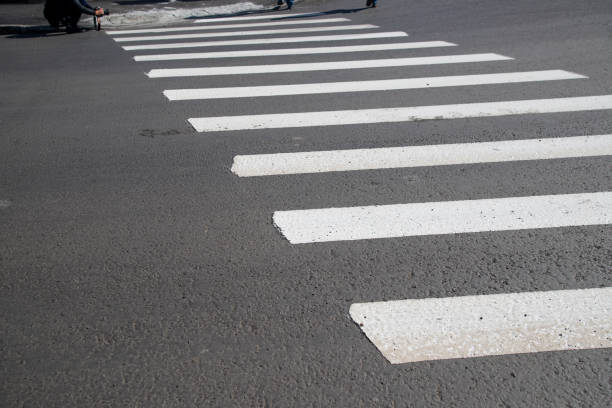 istock Zebra cross walk on asphalt road. 1266016024