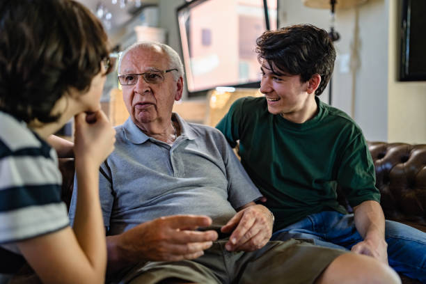 istock Grandfather and grandsons spending time talking 1266022458