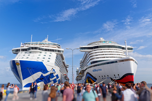 Tallinn, Estonia - August 12, 2019: Passengers getting off from cruise ships Aida Prima and Diamond Princess