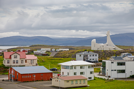 Stykkisholmur, Snaefellsness, Western Iceland, June 28, 2020: Residential buildings and a modern church in the center of the city