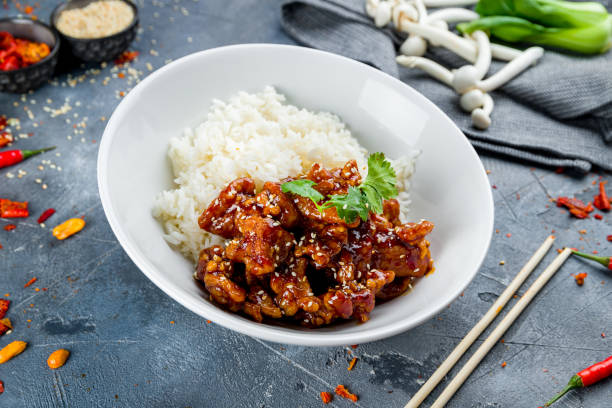 istock Fried chicken in caramel sauce with rice 1266047710