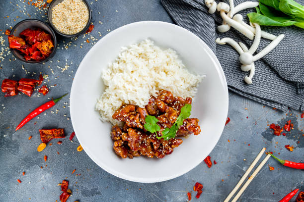 istock Fried chicken in caramel sauce with rice 1266048342