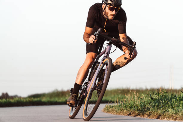 istock professional biker on the road 1266048903