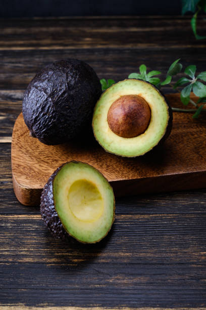 istock Fresh organic avocado on wooden table 1266050674